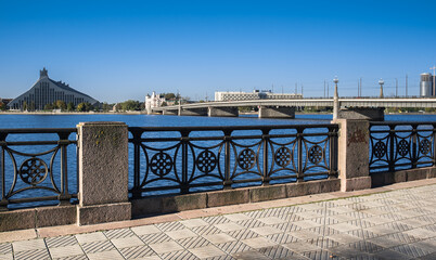 Fototapeta premium The Stone Bridge (Akmens tilts) and the Railway Bridge (Dxelzcela tilts) across Daugava river, Riga, Latvia.