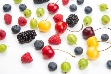 Assorted fresh different berries on a white background. useful vitamin healthy food fruit. healthy vegetable breakfast