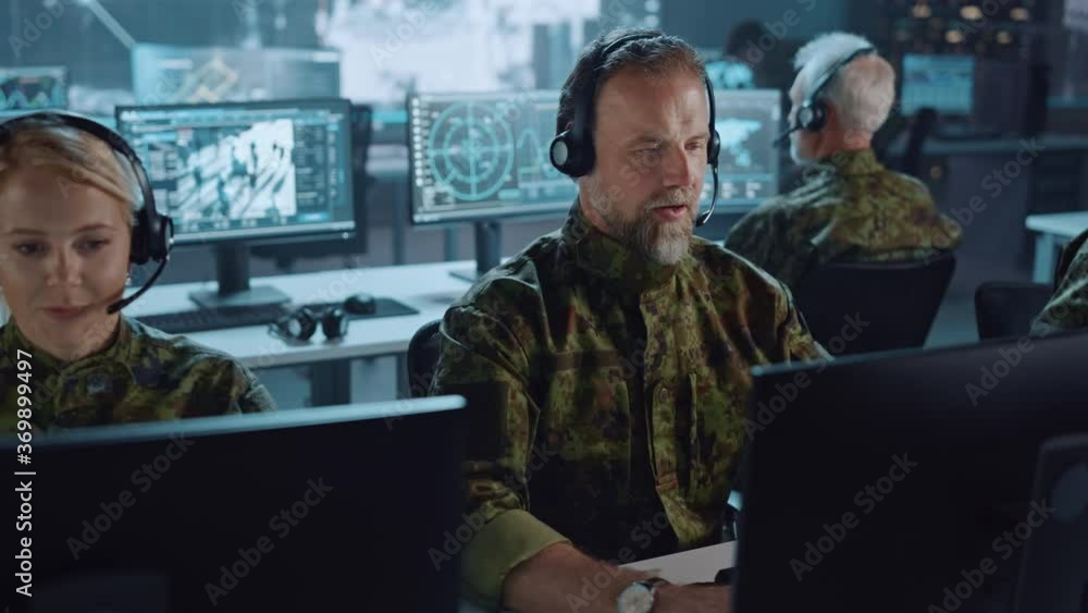 Poster military surveillance team of officers in headsets working in a central office hub for cyber operati