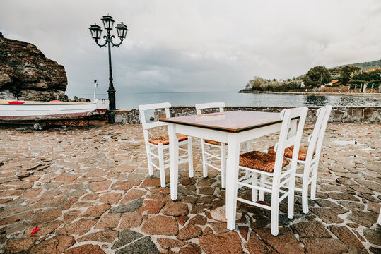 Lesbos island, Greece - A beautiful seat in the Aegean Sea on the island of Lesvos, facing the sea. Romantic dinner in the restaurant on holidays. Greece tavern.