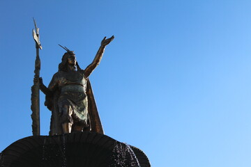 Fototapeta na wymiar Inca golden statue in central cusco plaza