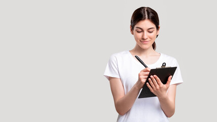 Social survey. Project research. Cheerful female assistant working on strategy planning with...