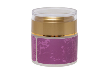 Cosmetic products isolated. Close-up of a gold and pink container with cosmetic night cream with a skin care product for face or other product with a empty label isolated on a white background. Macro.