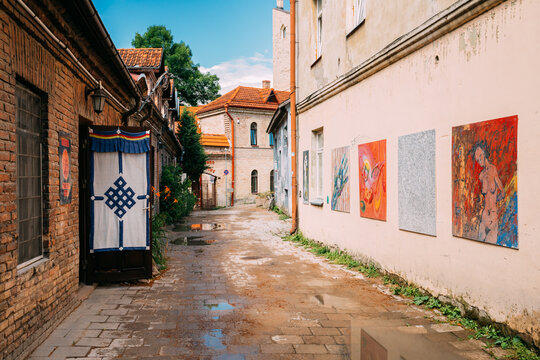 Vilnius, Lithuania. Art Objects Of Uzupis Located In Old Town Of Vilnius. Exposition Of Paintings Are On Streets Of City. District Of Vilniaus Senamiestis.