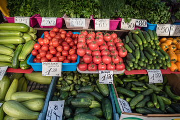 A colorful assortment of fresh fruits and vegetables neatly and attractively arranged on stands for sale at Riga Central Market, Latvia. 