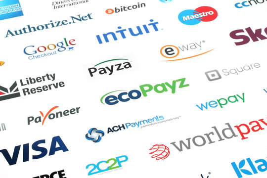 Kiev, Ukraine - February 10, 2016: Collection of popular payment system logos printed on white paper: PayPal, Google Bitcoin, Mastercard, Maestro, Skrill, JCB, Payoneer, Visa and other