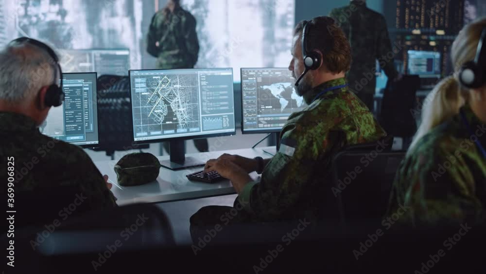 Aufkleber Military Surveillance Officer Working on a City Tracking Operation in a Central Office Hub for Cyber Control and Monitoring for Managing National Security, Technology and Army Communications.