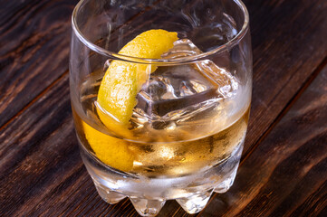Glass of whiskey with ice cube