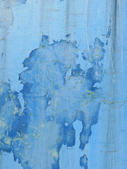 blue paint on a metal container making an abstract painting