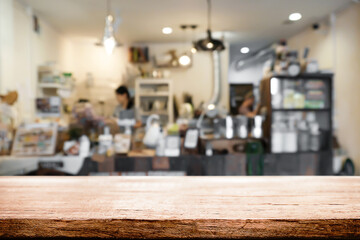 Empty wooden table space platform and blurred restaurant or coffee shop background for product display montage.