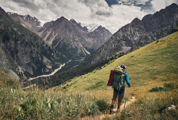Fototapeta na wymiar Hiker with big backpack in the mountains