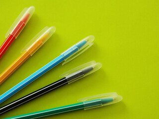 pens on a green background
