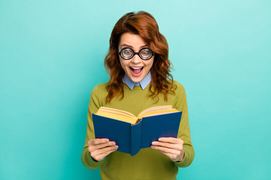 Close-up portrait of nice crazy overjoyed childish funny cheerful cheery amazed wavy-haired girl reading interesting book isolated bright vivid shine vibrant teal turquoise color background