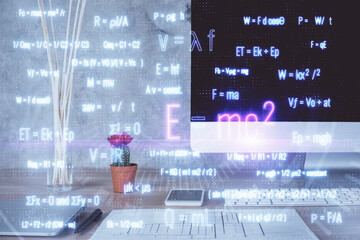 Desktop computer background and formula hologram writing. Double exposure. Education concept.