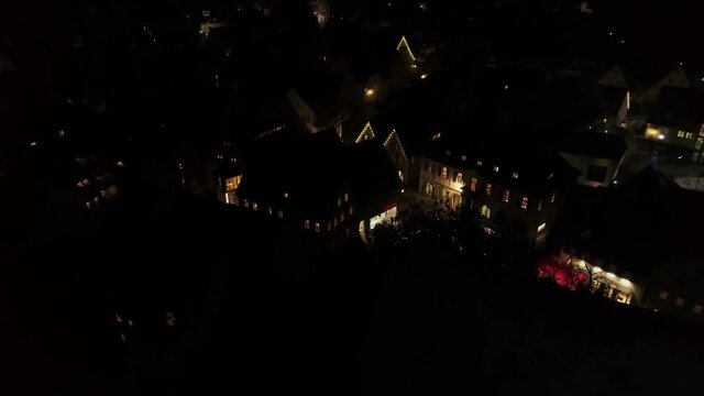 Drone flight night Germany in city Weilheim an der Teck - Townhall and church
