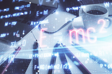 Desktop computer background and formula hologram writing. Double exposure. Education concept.