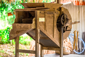 Blurred abstract background of traditional tools used for milling rice, used in rural agricultural plots.