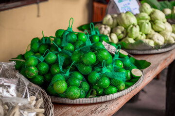 The blurred abstract background of fruits placed in a basket (lemon, guava) can be used for cooking or as a healthy alternative.