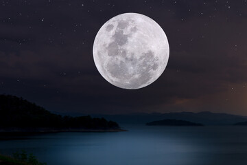 Fototapeta na wymiar Full moon over lake in the night.