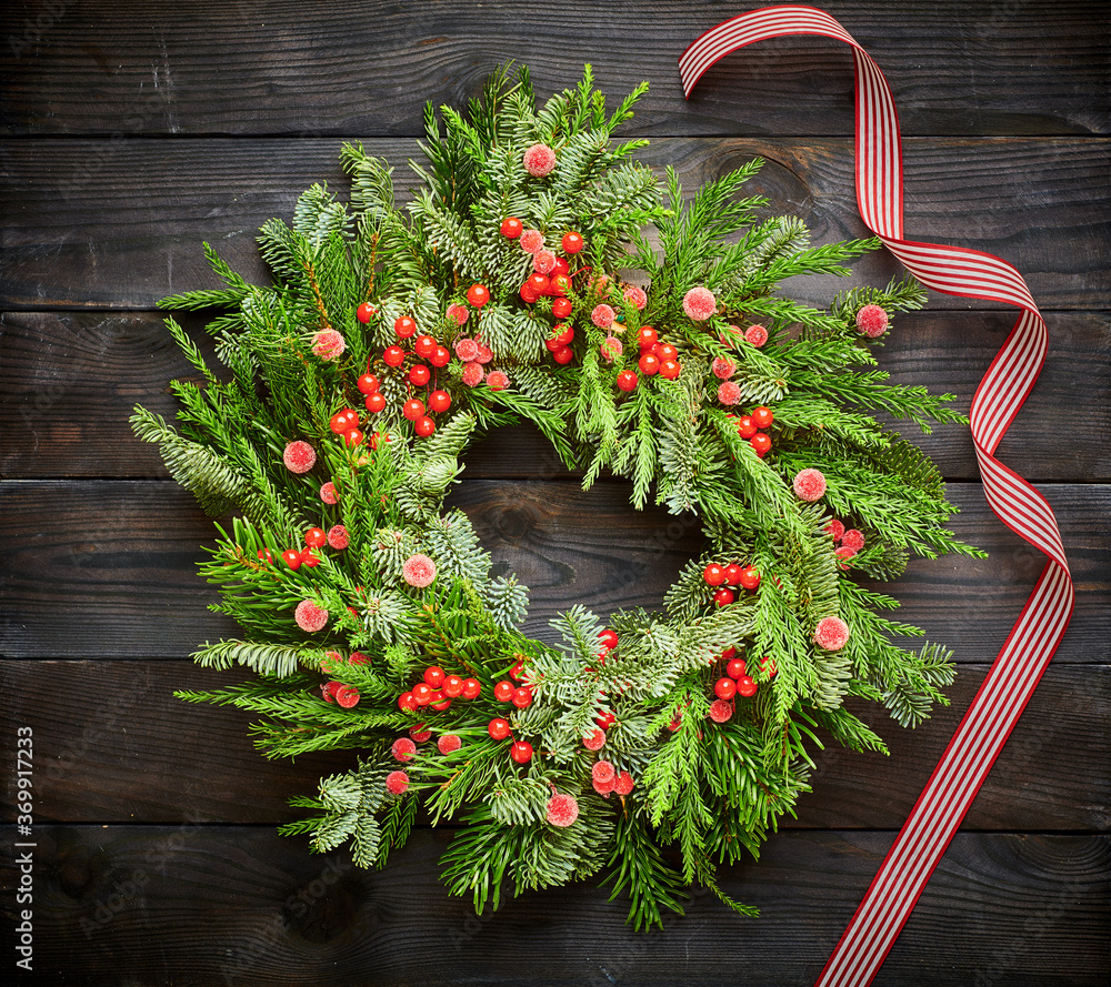 Sticker christmas wreath on dark wooden background