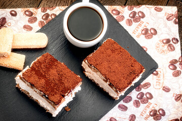 Creamy tiramisu and coffee, homemade tiramisu delicious dessert for pleasure

