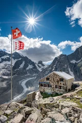 Fotobehang Oberaletsch Mountain hut with Oberaletsch Glacier and the Swiss and Valais Flag © schame87