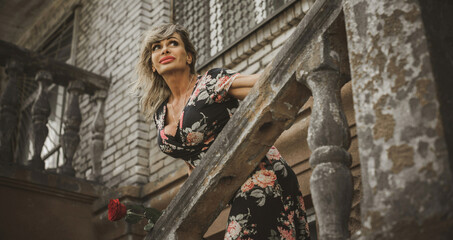 Other beauty, Bodybuilder older woman on a nature. Life of mature fit woman. Lady demonstration her body with a tan