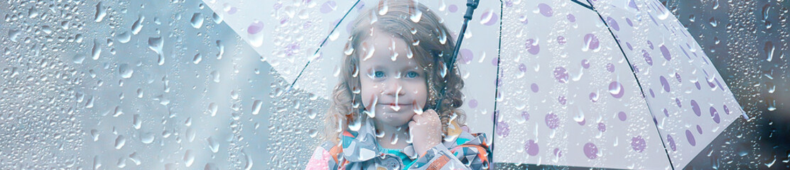 portrait of a girl child in the rain / autumn portrait, little girl drops raincoat rain weather