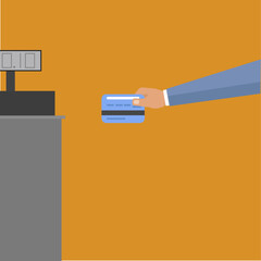 Hand reaches out to the cash register to pay by card for purchases from the store