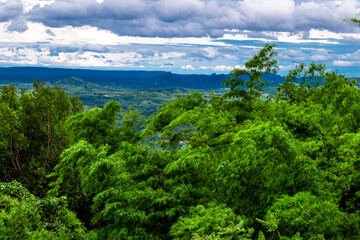 Obraz premium Natural high angle panoramic background With an atmosphere surrounded by mountains and trees, with a blurred wind, cool