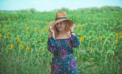 Woman at field wear rustic straw hat , boho cotton dress, ladies fashion