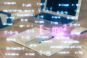 Desktop computer background and formula hologram writing. Double exposure. Education concept.