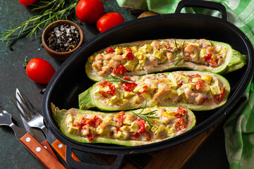 Healthy food. Baked zucchini stuffed with meat and tomatoes in a cast-iron pan.