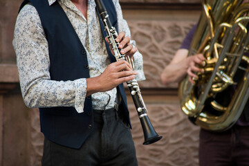  Closeup of musician playing with a clarinet in the street