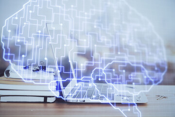 Multi exposure of work table with computer and brain hologram. Brainstorm concept.