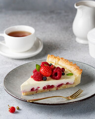 Piece of cheesecake with berries on a plate