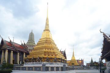 Fototapeta na wymiar Two gilt chedis Part of Wat Phra Kaew no people
