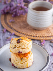 Traditional British scones with a tea cup and blurred background