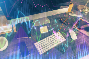 Multi exposure of chart and financial info and work space with computer background. Concept of...