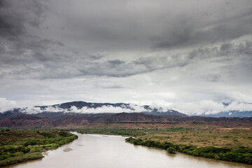 A large body of water with a mountain in the background