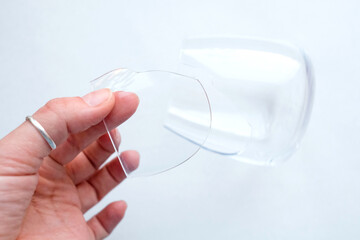 Hold a piece of broken glass in your hand. View from above