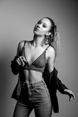 Fototapeta premium Pretty young model wears bra and jeans