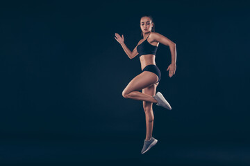 Full size profile photo short sport suit lady practicing warm up before sprint run jogging isolated black background