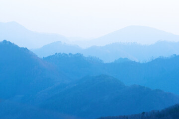 Naklejka premium The Red and Blue autumn color mountain of the Morning. At dawn.