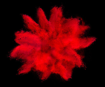 red holi paint color powder explosion isolated dark black background. industry beautiful party festival concept
