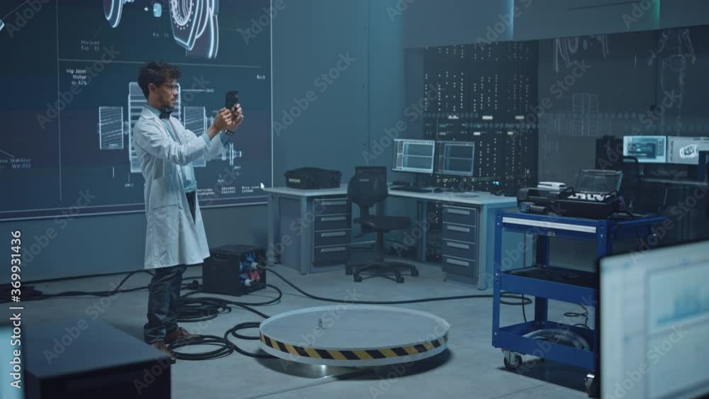 Poster In High-Tech Development Laboratory: Engineer Uses Digital Tablet Computer with Augmented Reality Software to Analyse Content. Modern Facility with Big Screens Showing Industrial Design