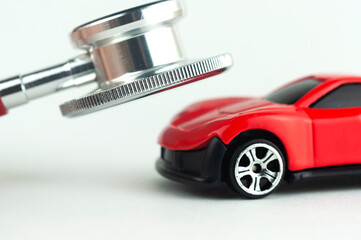 a stethoscope and a car concept of repair and diagnostics of the car