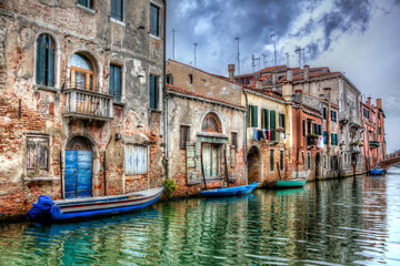 Fototapeta na wymiar Boats Moored in a Canal in Venice