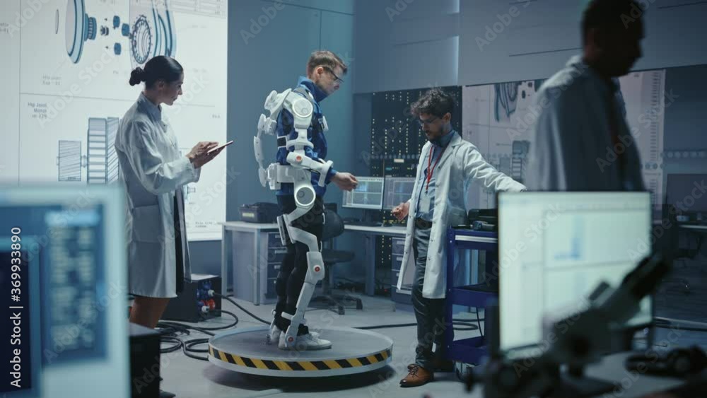 Aufkleber In Robotics Development Laboratory: Engineers and Scientists Work on a Bionics Exoskeleton Prototype with Person Testing it. Designing Wearable Exosuit to Help Disabled People, Warehouse Workers
