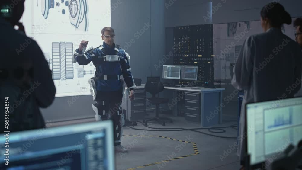 Aufkleber In Development Laboratory: Engineers and Scientists Look at Robotics Exoskeleton Prototype Presentation with Person Testing it, Moving and Performing. Designing Wearable Exosuit to Help People
